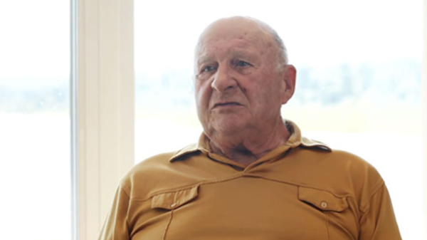 Robert is shown speaking to the camera